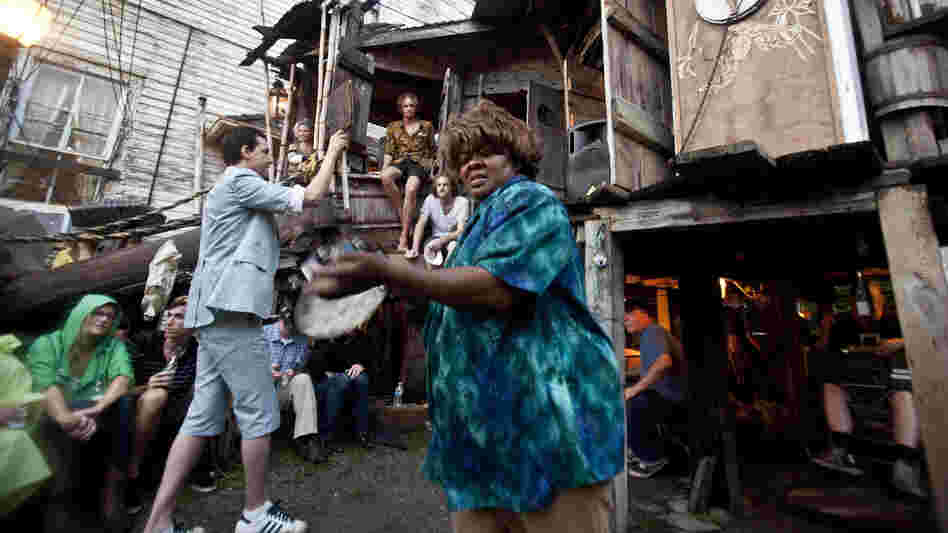 Quintron (at left, in suit and shorts) conducts while Lady Tambourine plays at The Music Box on Saturday night.