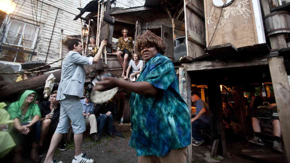 Quintron (at left, in suit and shorts) conducts while Lady Tambourine plays at The Music Box on Saturday night.