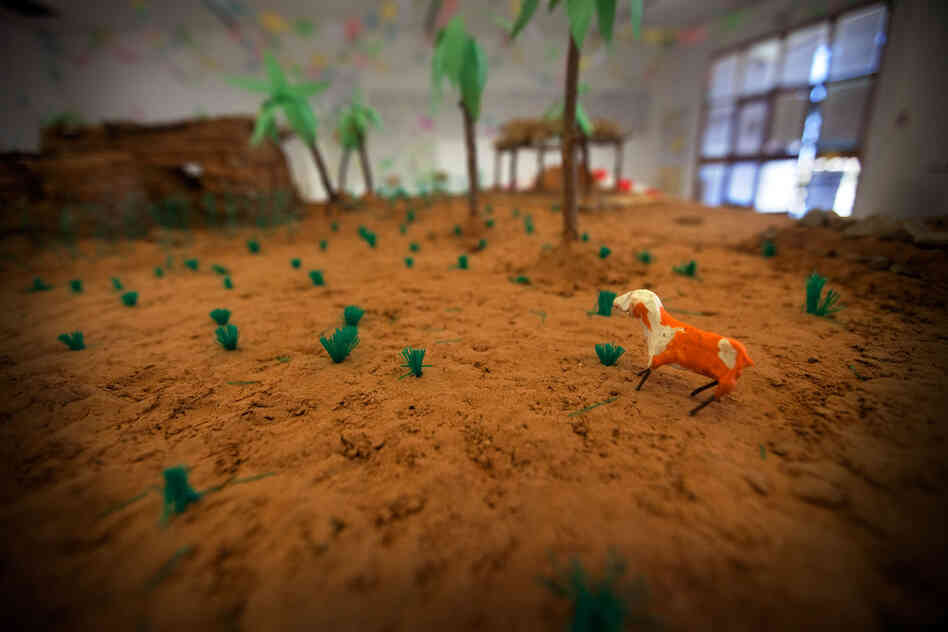 A diorama at the Tawargha refugee camp that represents their old home.