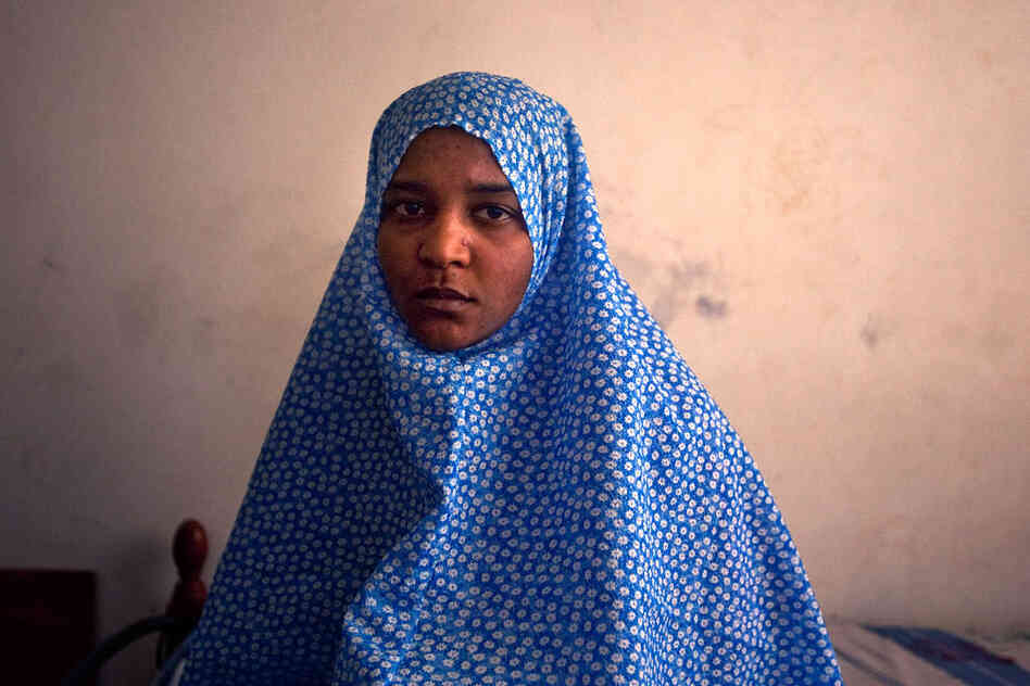 Houda Mohammed Belaid says that when she and her sister joined a protest march against their status as refugees from Tawargha, gunman attacked the protest march and shot them.