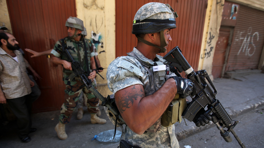 Syria's turmoil has been spreading into Lebanon, where residents say Syrian soldiers have crossed the border and killed civilians. Here, Lebanese army soldiers patrol in the northern port city of Tripoli, Lebanon, earlier this month, where clashes broke out between pro- and anti-Syria gunmen.