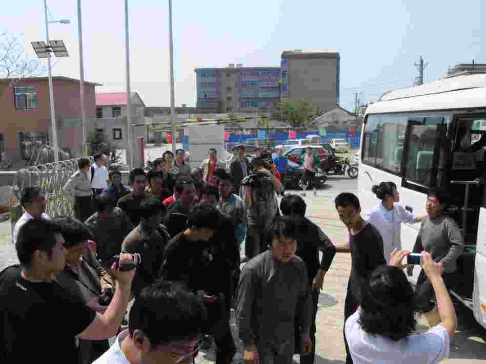 Chinese fishermen — detained for 13 days by North Korea — return to Dalian, in northeast China's Liaoning province, May 21.