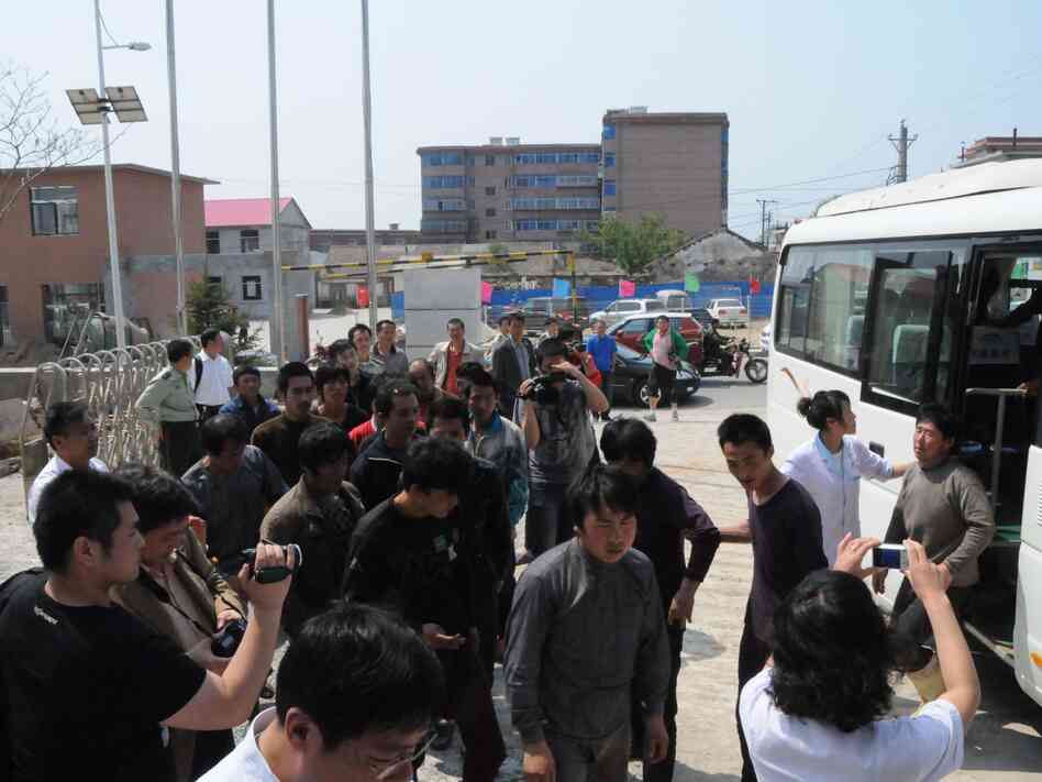 Chinese fishermen — detained for 13 days by North Korea — return to Dalian, in northeast China's Liaoning province, May 21.