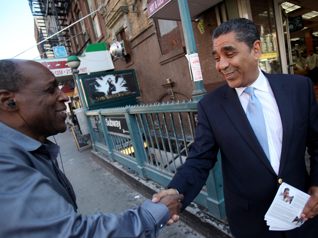 New York state Sen. Adriano Espaillat campaigns on the corner of 110th Street and Lexington Avenue in New York's Harlem in May. Espaillat is running for the incumbent Rangel's seat in what is now the 13th Congressional District.