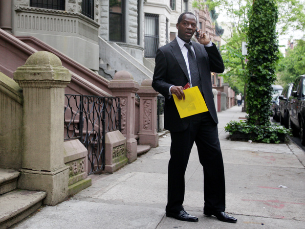 Clyde Williams takes a break from canvassing in Manhattan's Harlem neighborhood on May 3. Williams is also running for Rangel's seat.