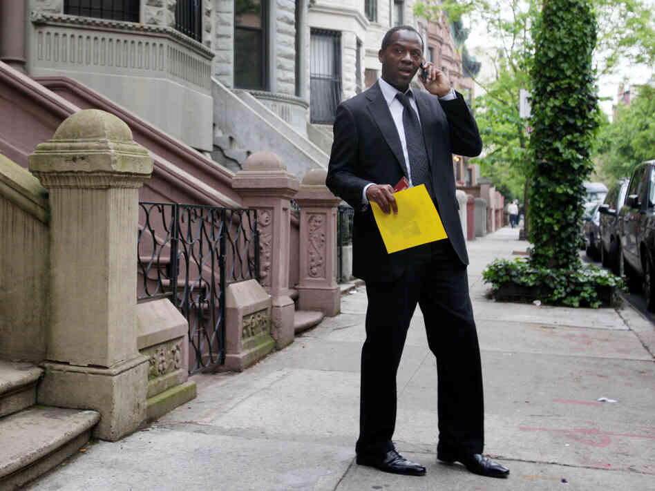Clyde Williams takes a break from canvassing in Manhattan's Harlem neighborhood on May 3. Williams is also running for Rangel's seat.