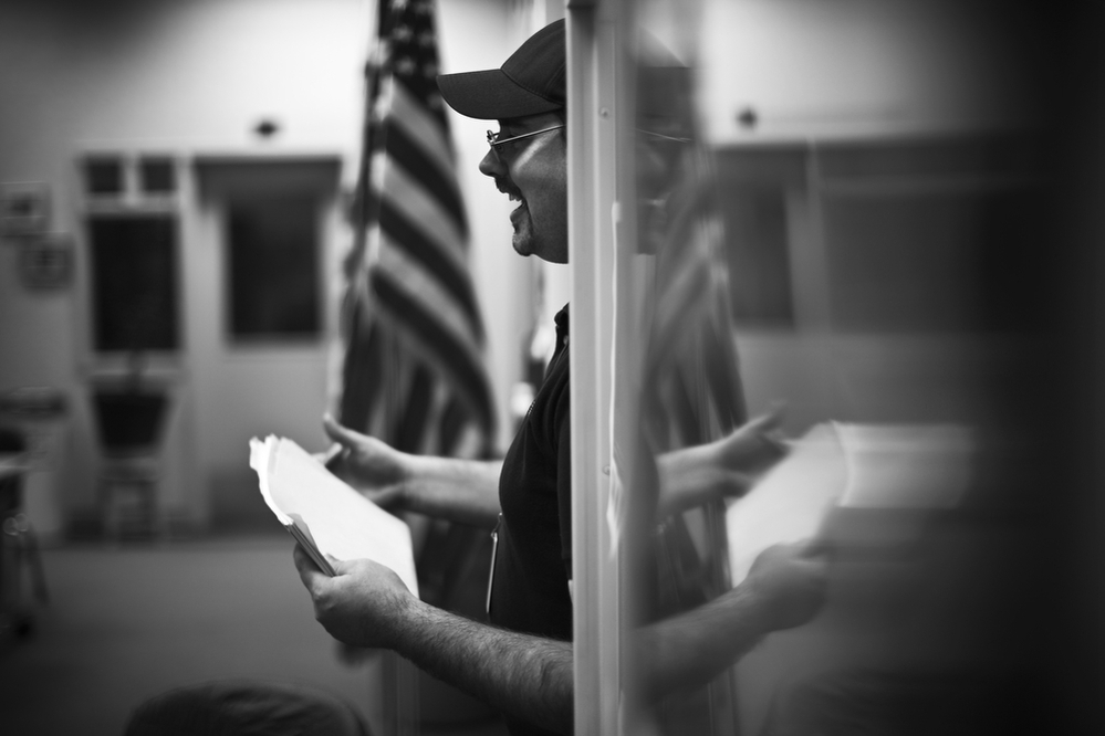 Eric Theeler goes over some of his class assignments with veterans and student-athletes, who share a workspace in Sierra College's library.