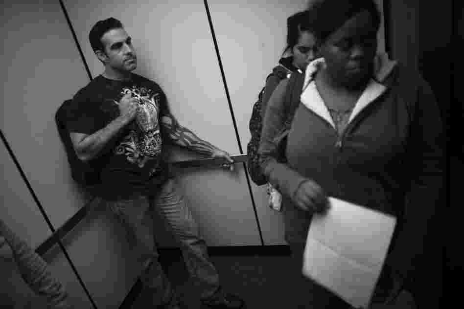 Jay Blake (left), who served multiple tours in Iraq as a Marine, rides the elevator with his fellow students in the library at Sierra College in Rocklin, Calif. Blake, who has struggled since returning home, says he finally settled into his studies with the help of Catherine Morris, an academic adviser who works with the vets on campus.