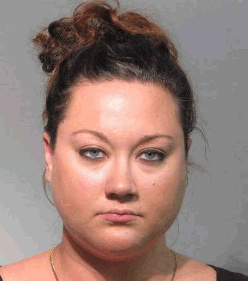 In this handout from the Seminole County Sheriff's Office, Shellie Zimmerman, wife of George Zimmerman, the man accused of shooting Trayvon Martin, is seen in a police mug shot on Tuesday in Sanford, Florida. In this handout from the Seminole County Sheriff's Office, Shellie Zimmerman, wife of George Zimmerman, the man accused of shooting Trayvon Martin, is seen in a police mug shot on Tuesday in Sanford, Florida.