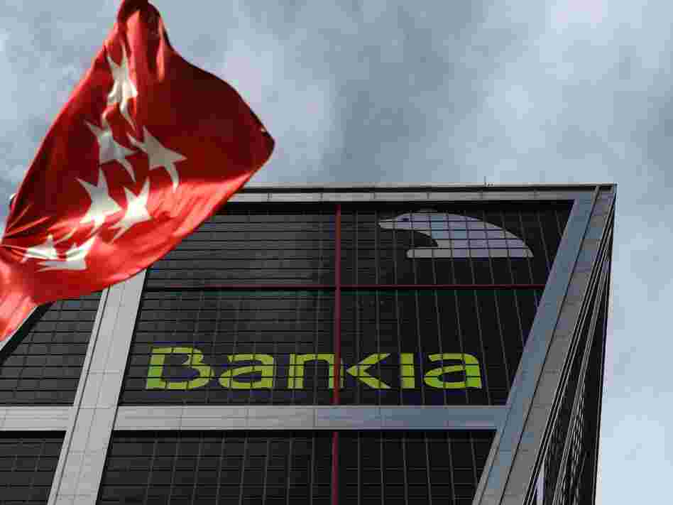 A bunch of troubled little Spanish banks got together and became Bankia, a troubled big Spanish bank.