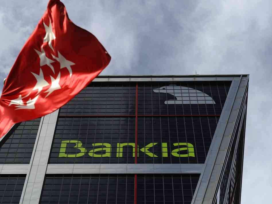 A bunch of troubled little Spanish banks got together and became Bankia, a troubled big Spanish bank.