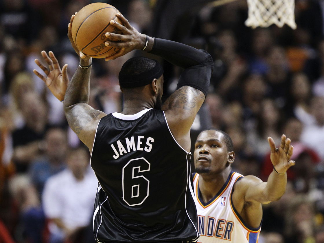 The Miami Heat's LeBron James and Kevin Durant of the Oklahoma City Thunder (shown during an April game) will match up again tonight in the first game of the NBA Finals.