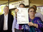 Lindy Chamberlain-Creighton holds her daughter Azaria's death certificate as ex-husband Michael Chamberlain (left) looks on after a coroner ruled today that a dingo snatched the baby from a tent in the Australian desert 32 years ago. Lindy Chamberlain-Creighton holds her daughter Azaria's death certificate as ex-husband Michael Chamberlain (left) looks on after a coroner ruled today that a dingo snatched the baby from a tent in the Australian desert 32 years ago.