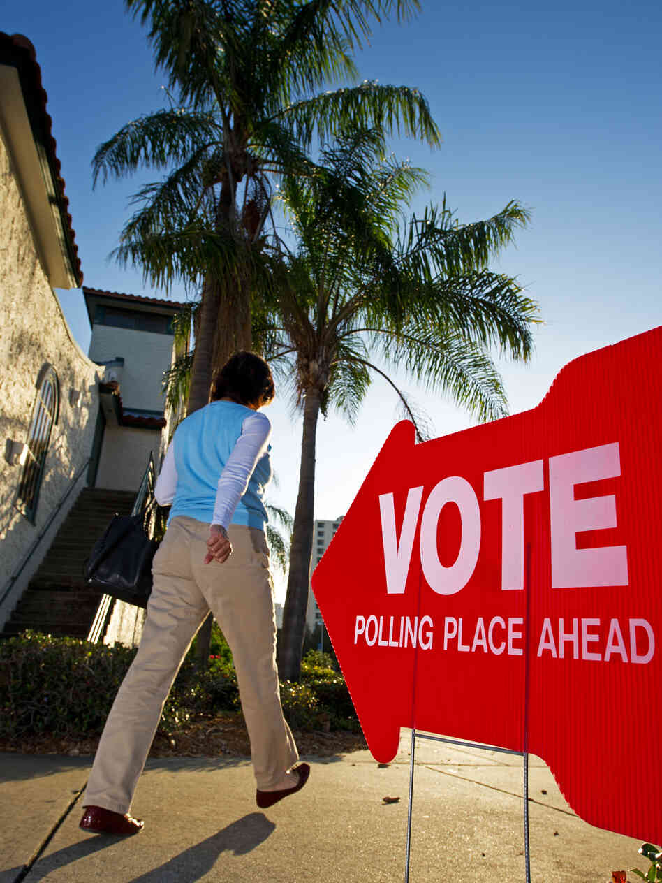 A Republican primary voter walks to her polling precinct in January in St. Petersburg, Fla.