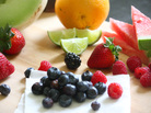 Fruit salad ingredients, including honeydew, watermelon, orange, lime, strawberries, blueberries and raspberries. Fruit salad ingredients, including honeydew, watermelon, orange, lime, strawberries, blueberries and raspberries.