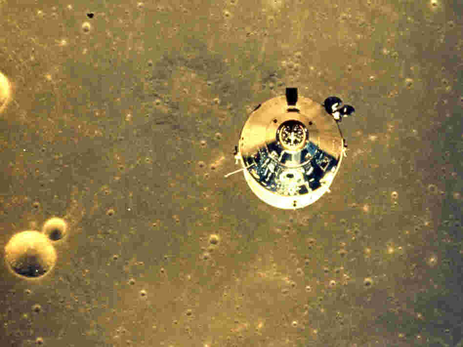 The Apollo 11 space module above the surface of the moon.