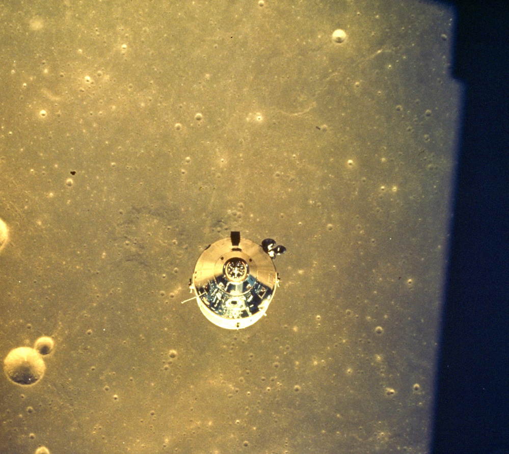 The Apollo 11 space module above the surface of the moon.
