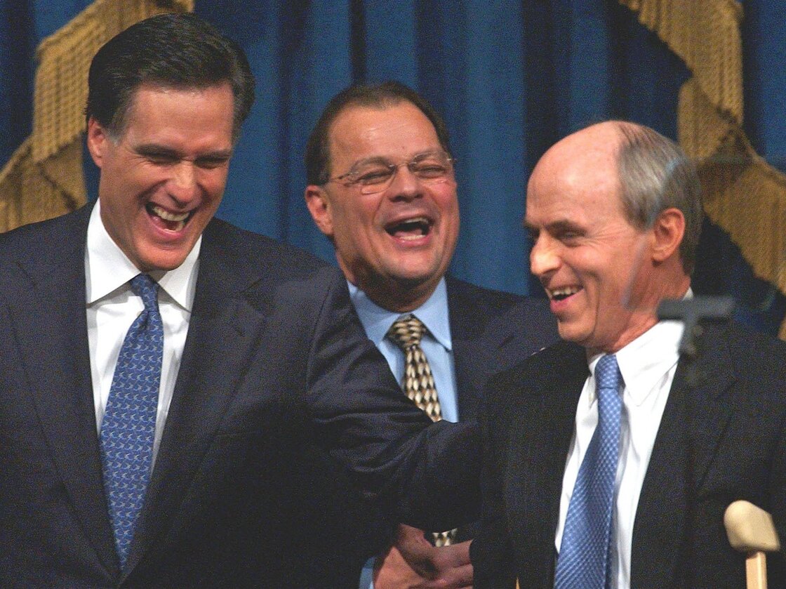 Romney shares a light moment with Senate President Robert E. Travaglini (center) and House Speaker Thomas Finneran before his State of the State address in 2004.