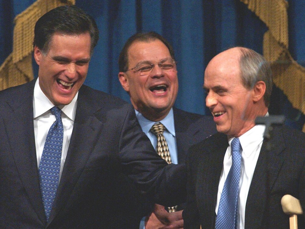 Romney shares a light moment with Senate President Robert E. Travaglini (center) and House Speaker Thomas Finneran before his State of the State address in 2004.