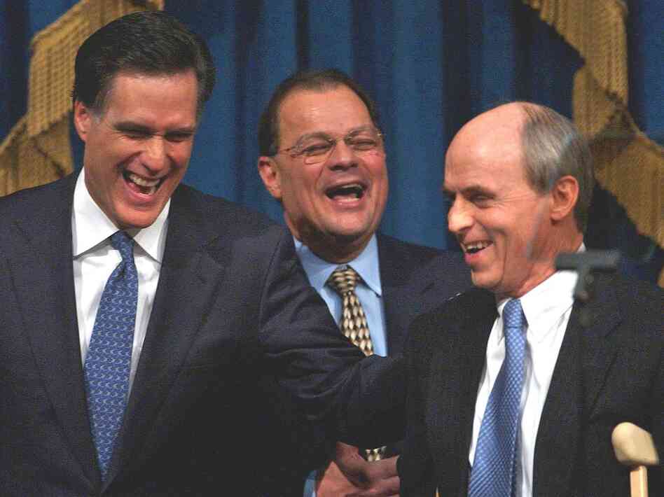 Romney shares a light moment with Senate President Robert E. Travaglini (center) and House Speaker Thomas Finneran before his State of the State address in 2004.