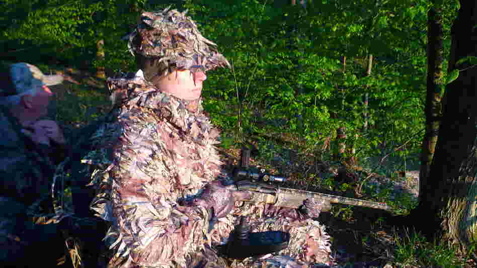 Jake Dobberke, 26, a Marine who lost his legs in Afghanistan, watches for turkeys in Potter County, Pa. The LEEK Hunting and Mountain Preserve helps healing young vets explore the wilderness in adaptive hunting gear.