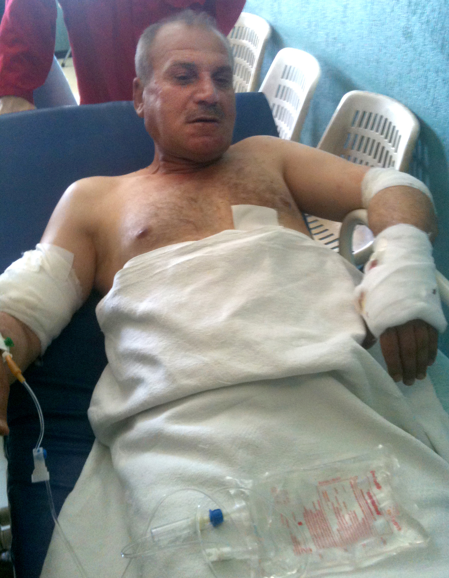 Col. Abdul Kareem Mustapha, 51, is being treated at Barzeh military hospital in Damascus. He was wounded in the Syrian capital Tuesday during an ambush by armed men in taxis that killed one of his fellow passengers.