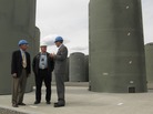 About 70,000 tons of used nuclear fuel sits mostly at power plants across the country. Much is kept underwater in spent fuel pools, but utility companies have been moving the fuel into concrete and steel casks like these in Richland, Wash. Energy Northwest CEO Vic Parrish (center) tours the facility with Reps. Doc Hastings (left) and Jay Inslee. About 70,000 tons of used nuclear fuel sits mostly at power plants across the country. Much is kept underwater in spent fuel pools, but utility companies have been moving the fuel into concrete and steel casks like these in Richland, Wash. Energy Northwest CEO Vic Parrish (center) tours the facility with Reps. Doc Hastings (left) and Jay Inslee.