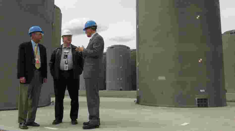 About 70,000 tons of used nuclear fuel sits mostly at power plants across the country. Much is kept underwater in spent fuel pools, but utility companies have been moving the fuel into concrete and steel casks like these in Richland, Wash. Energy Northwest CEO Vic Parrish (center) tours the facility with Reps. Doc Hastings (left) and Jay Inslee. About 70,000 tons of used nuclear fuel sits mostly at power plants across the country. Much is kept underwater in spent fuel pools, but utility companies have been moving the fuel into concrete and steel casks like these in Richland, Wash. Energy Northwest CEO Vic Parrish (center) tours the facility with Reps. Doc Hastings (left) and Jay Inslee.