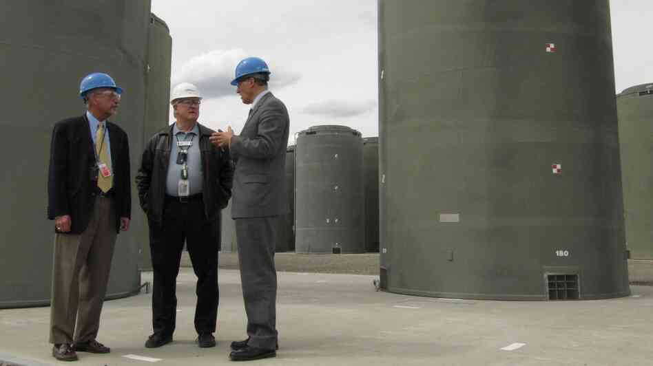 About 70,000 tons of used nuclear fuel sits mostly at power plants across the country. Much is kept underwater in spent fuel pools, but utility companies have been moving the fuel into concrete and steel casks like these in Richland, Wash. Energy Northwest CEO Vic Parrish (center) tours the facility with Reps. Doc Hastings (left) and Jay Inslee. About 70,000 tons of used nuclear fuel sits mostly at power plants across the country. Much is kept underwater in spent fuel pools, but utility companies have been moving the fuel into concrete and steel casks like these in Richland, Wash. Energy Northwest CEO Vic Parrish (center) tours the facility with Reps. Doc Hastings (left) and Jay Inslee.