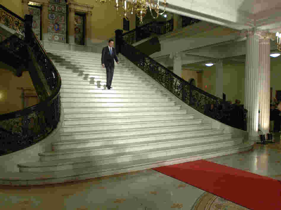 Romney walks down the central staircase inside the Statehouse during a ceremony marking the end of his term as governor on Jan. 3, 2007.