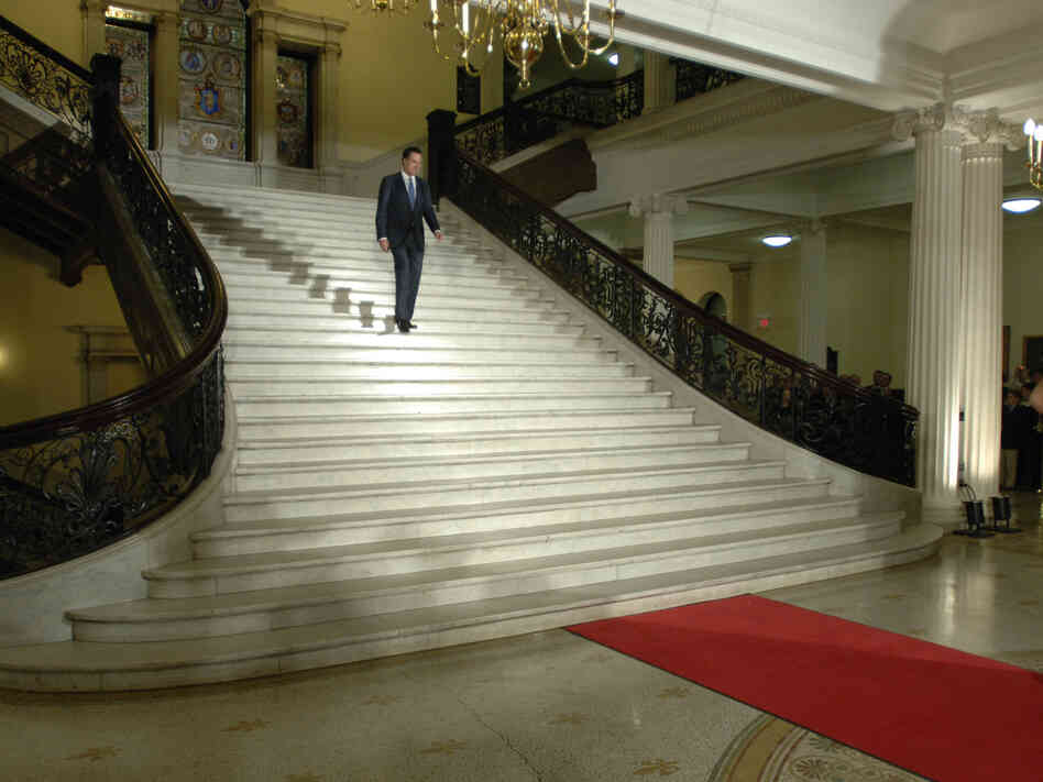 Romney walks down the central staircase inside the Statehouse during a ceremony marking the end of his term as governor on Jan. 3, 2007.