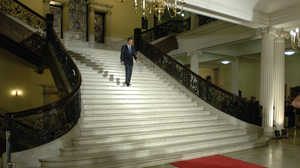 Romney walks down the central staircase inside the Statehouse during a ceremony marking the end of his term as governor on Jan. 3, 2007.