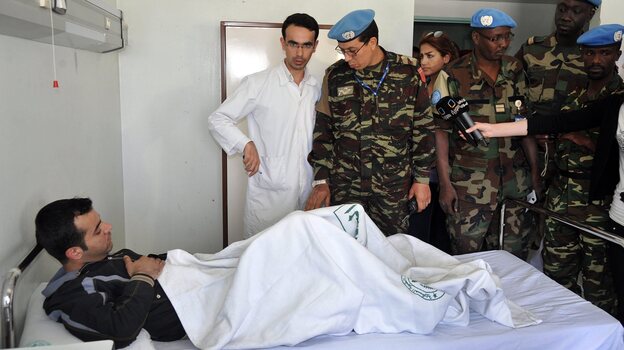 Members of the U.N. observers mission in Syria visit wounded soldiers and policemen at Tishreen Military Hospital in Damascus on May 23. Casualties among Syrian government forces are rising sharply.