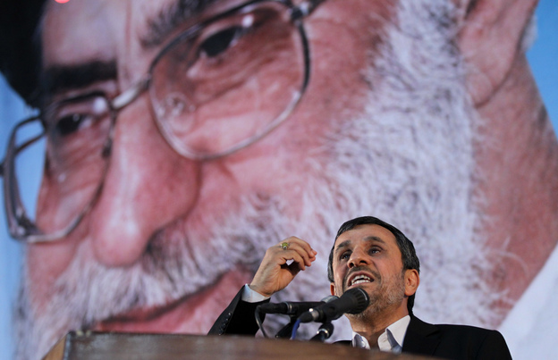 Iranian President Mahmoud Ahmadinejad delivers a speech under a portrait of Iran's supreme leader, Ayatollah Ali Khamenei, on June 2. The supreme leader has said repeatedly that nuclear weapons are un-Islamic and Iran will not pursue them. But in the West, many are skeptical.