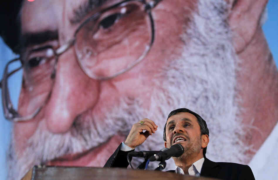 Iranian President Mahmoud Ahmadinejad delivers a speech under a portrait of Iran's supreme leader, Ayatollah Ali Khamenei, on June 2. The supreme leader has said repeatedly that nuclear weapons are un-Islamic and Iran will not pursue them. But in the West, many are skeptical.