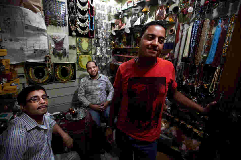 Scenes from the Khan el-Khalili market in downtown Cairo. Karim Gomma (right), a shop worker, says he's voting for the Muslim Brotherhood candidate, Mohammed Mursi. But he says most shop owners are voting for Ahmed Shafiq because he has promised to restore law and order.
