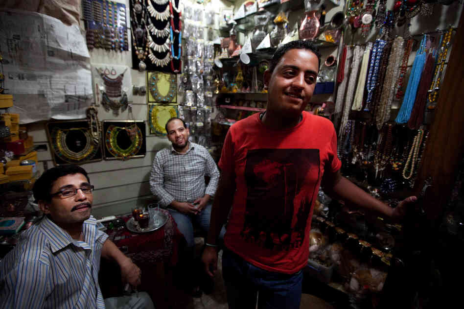 Scenes from the Khan el-Khalili market in downtown Cairo. Karim Gomma (right), a shop worker, says he's voting for the Muslim Brotherhood candidate, Mohammed Mursi. But he says most shop owners are voting for Ahmed Shafiq because he has promised to restore law and order.