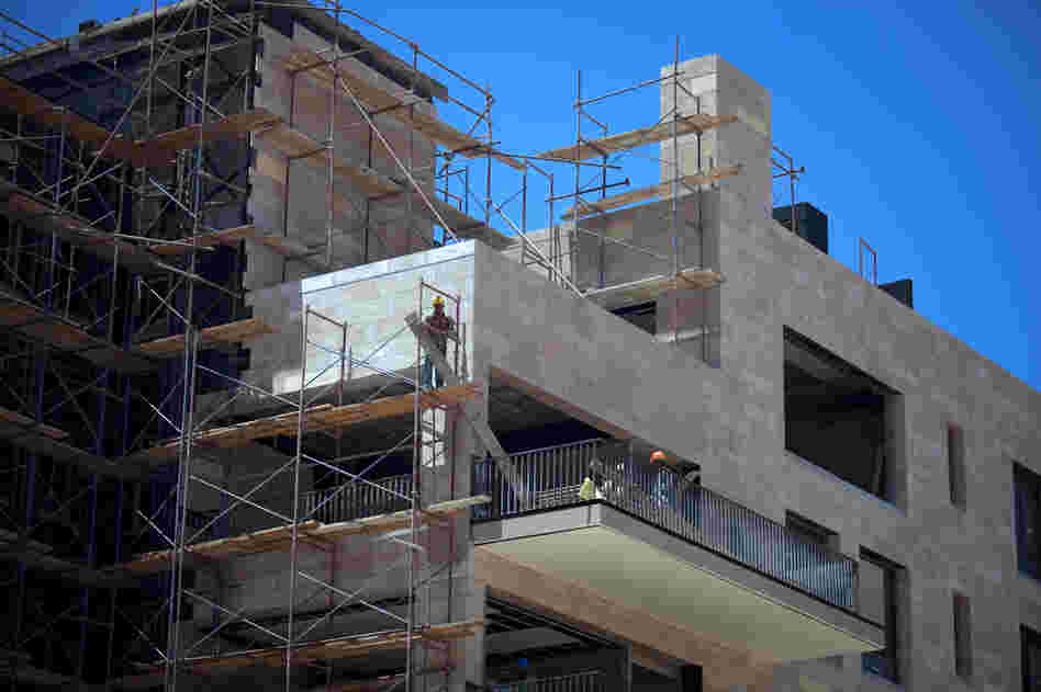 Building construction in the upscale SODIC housing development outside Cairo.