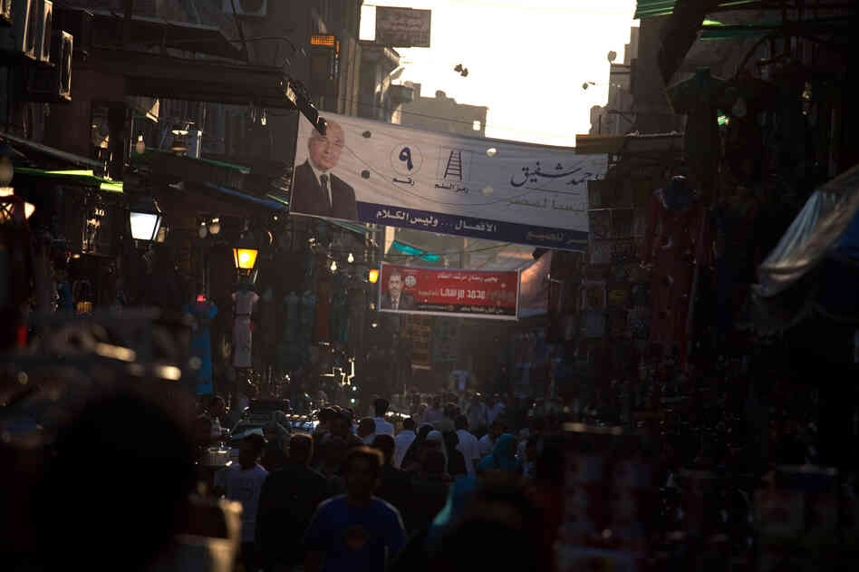 The Khan el-Khalili market in downtown Cairo. Election posters for the two candidates in Egypt's presidential runoff election are hanging above the street.