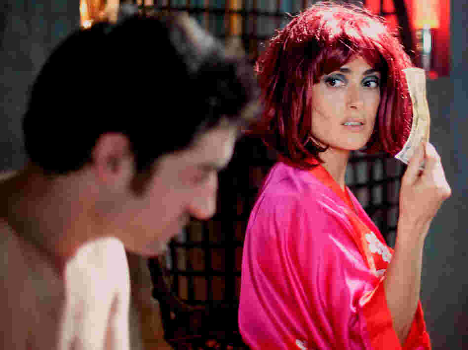 Lola is a stripper who is suspicious of Martin's intentions, and charges him for every conversation.