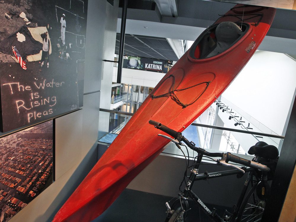 A kayak used by Times-Picayune photographer John McCusker to cover Hurricane Katrina is displayed at the Newseum in Washington, D.C., in 2010. McCusker, who worked for the paper for 25 years, is being laid off.