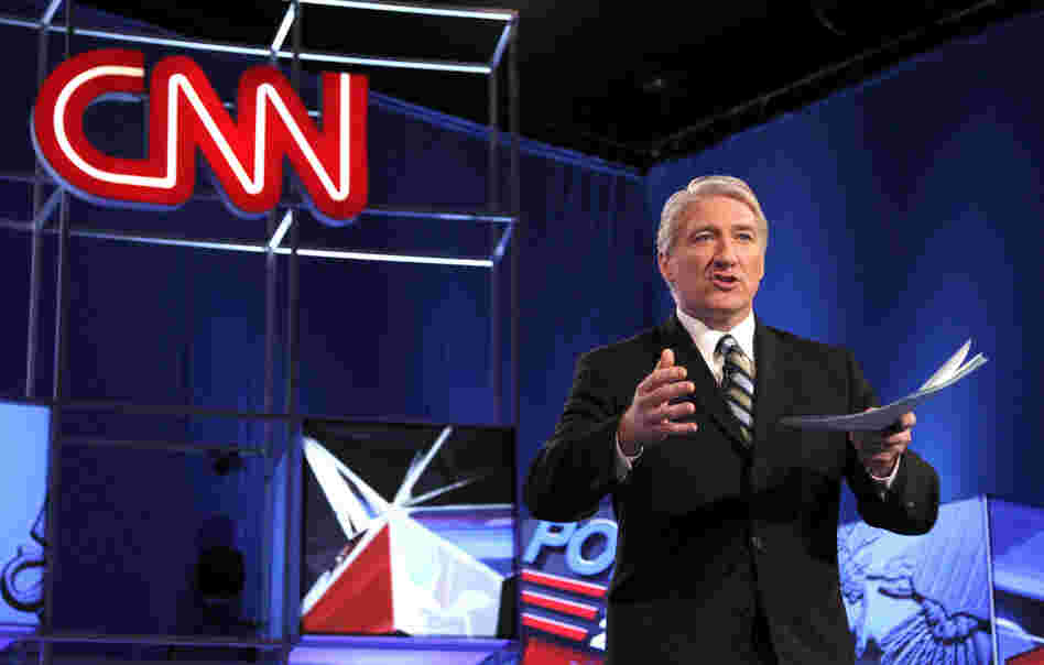 Moderator from CNN John King speaks to the crowd before a Republican presidential debate.