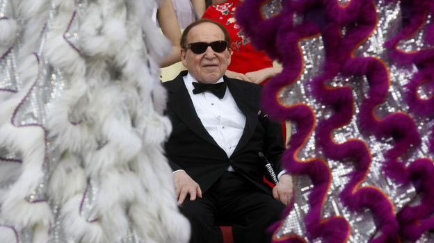 Las Vegas casino magnate Sheldon Adelson watches a performance at the Sands Cotai Central in Macau in April.