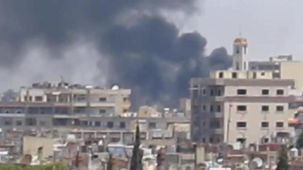 A frame grab from a video taken by U.N. observers as smoke rose over the Syrian city of Homs earlier this week. The observers said Homs had been shelled by Syrian government forces.