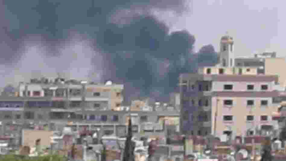 A frame grab from a video taken by U.N. observers as smoke rose over the Syrian city of Homs earlier this week. The observers said Homs had been shelled by Syrian government forces. A frame grab from a video taken by U.N. observers as smoke rose over the Syrian city of Homs earlier this week. The observers said Homs had been shelled by Syrian government forces.