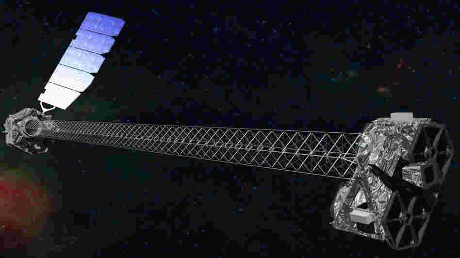 This artist's illustration shows what NuSTAR should look like in orbit after its 30-foot-long mast deployed.