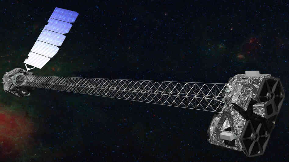 This artist's illustration shows what NuSTAR should look like in orbit after its 30-foot-long mast deployed.