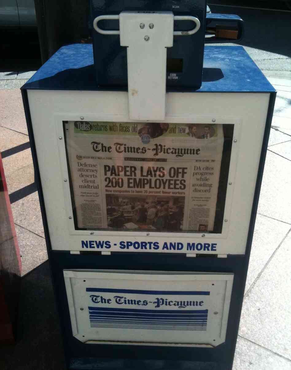A New Orleans newspaper stand holds copies of Wednesday's Times-Picayune, which announced layoffs for 200 employees.