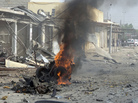 Smoke rises from the wreckage of a vehicle in Kirkuk, Iraq. A bomb in it exploded — one of a series of coordinated attacks today on Shiite Muslims across the country. Smoke rises from the wreckage of a vehicle in Kirkuk, Iraq. A bomb in it exploded — one of a series of coordinated attacks today on Shiite Muslims across the country.