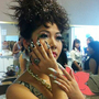 A model shows off an ABC student's work. Most of the students are studying manicuring.